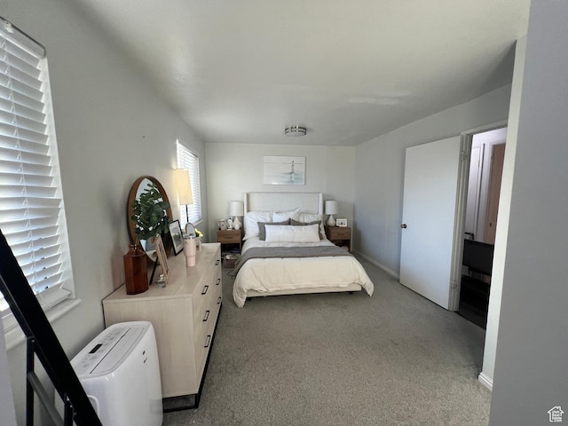 carpeted bedroom with baseboards