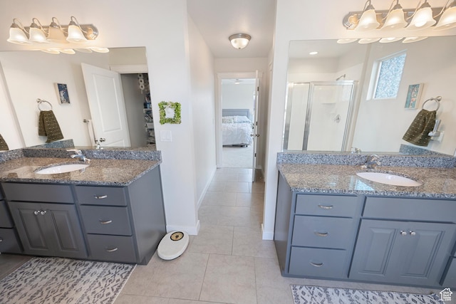 417 N Hill Farms Ln, Kaysville, UT 84037 - bathroom featuring a stall shower, two vanities, a sink, and tile patterned floors
