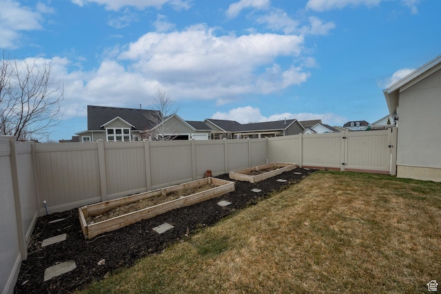 417 N Hill Farms Ln, Kaysville, UT 84037 - view of yard featuring a gate, a residential view, fence, and a garden