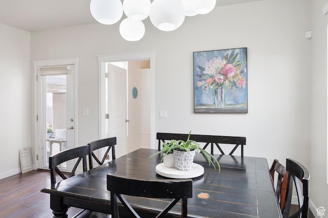 417 N Hill Farms Ln, Kaysville, UT 84037 - dining area featuring baseboards, a chandelier, and wood finished floors