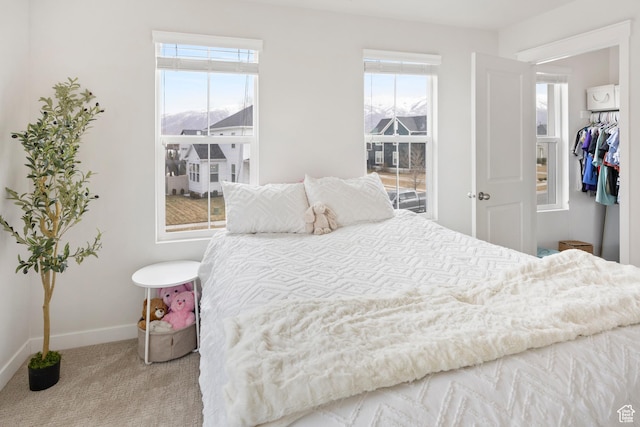 417 N Hill Farms Ln, Kaysville, UT 84037 - carpeted bedroom featuring multiple windows and baseboards