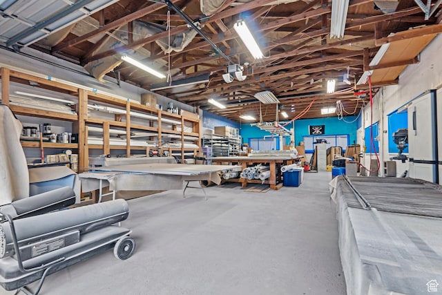 misc room featuring concrete floors and a workshop area
