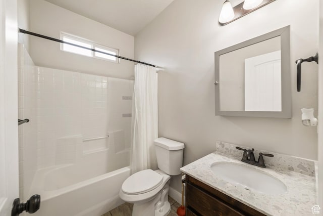 bathroom with shower / tub combo with curtain, vanity, and toilet
