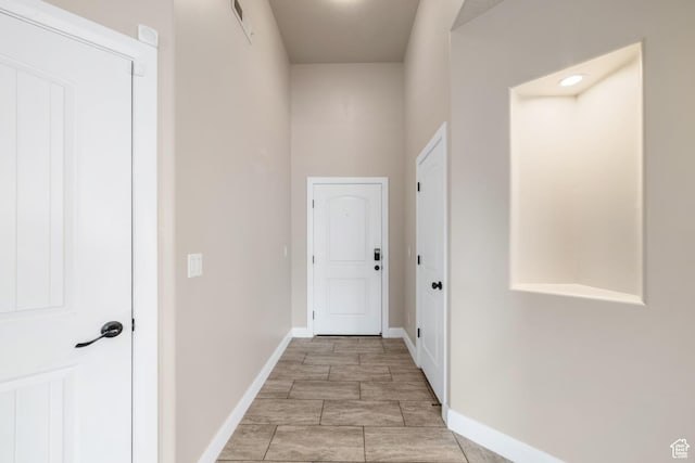hall featuring baseboards