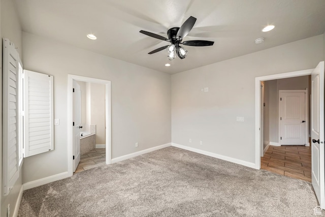 unfurnished bedroom featuring recessed lighting, carpet flooring, ensuite bath, and baseboards