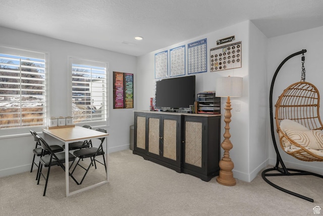 carpeted home office featuring recessed lighting, baseboards, and a textured ceiling
