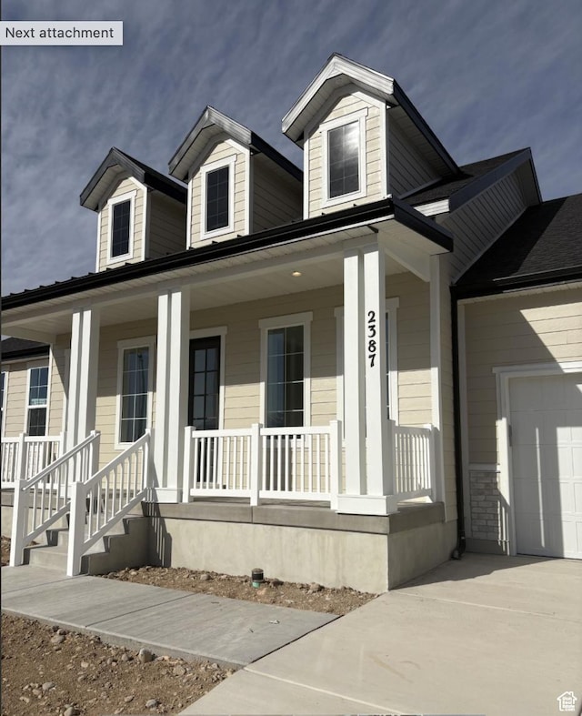 2387 E Canyon Crest Dr Unit 44, Spanish Fork, UT 84660 - view of front of home with a garage, driveway, and a porch