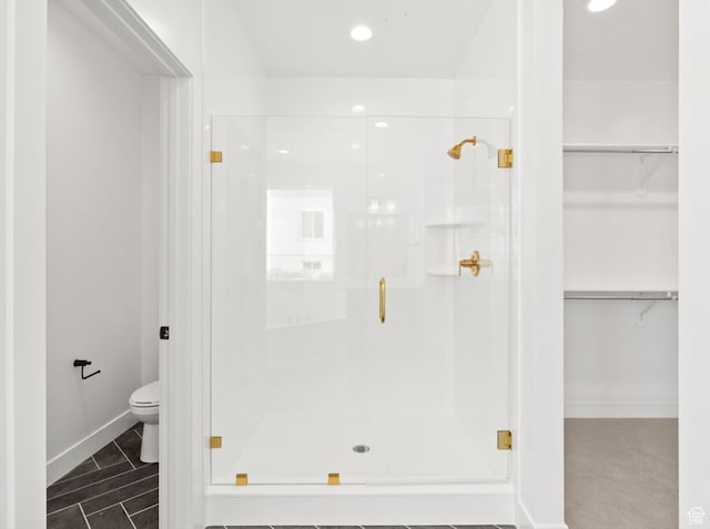 2387 E Canyon Crest Dr Unit 44, Spanish Fork, UT 84660 - bathroom featuring a stall shower, a walk in closet, and recessed lighting