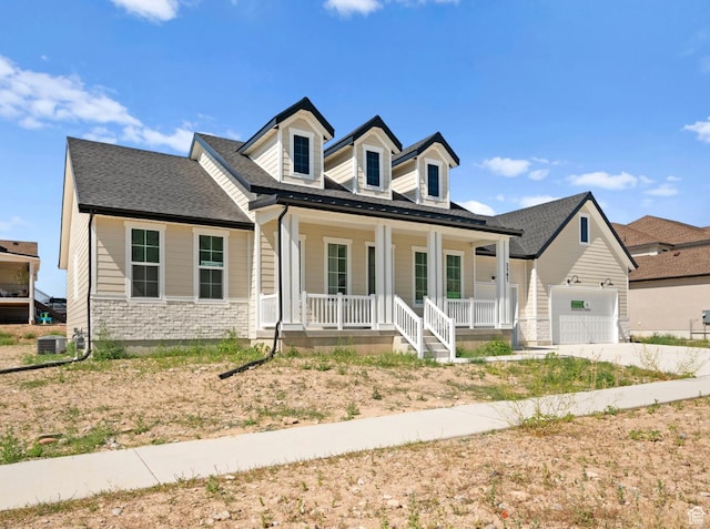 2387 E Canyon Crest Dr Unit 44, Spanish Fork, UT 84660 - view of front of home with a porch, stone siding, roof with shingles, an attached garage, and concrete driveway