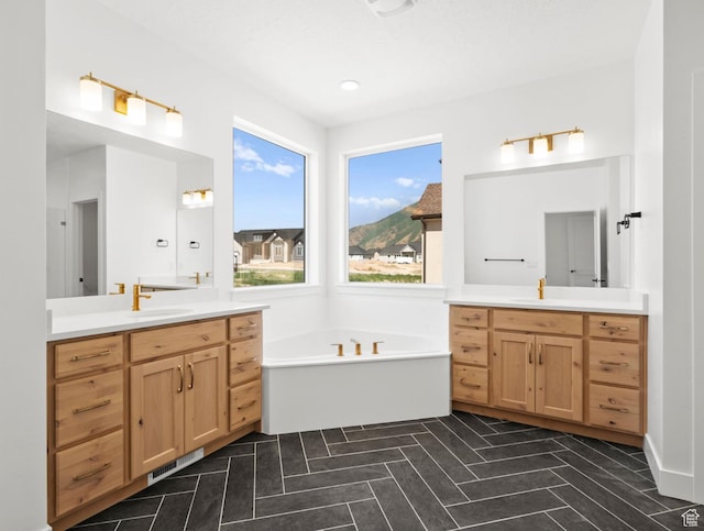 2387 E Canyon Crest Dr Unit 44, Spanish Fork, UT 84660 - bathroom with two vanities and a garden tub