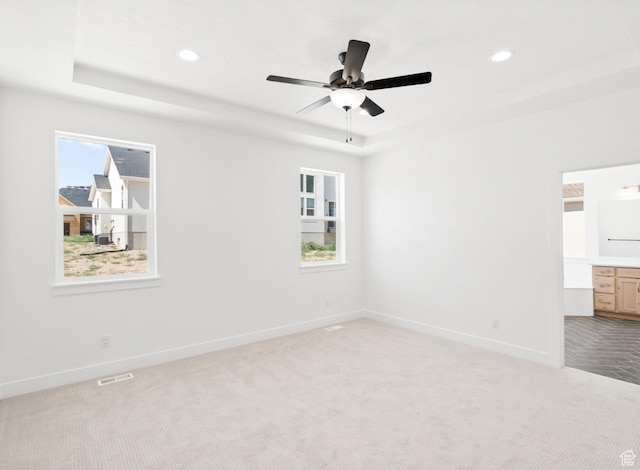 2387 E Canyon Crest Dr Unit 44, Spanish Fork, UT 84660 - spare room featuring a raised ceiling, carpet flooring, a ceiling fan, and recessed lighting