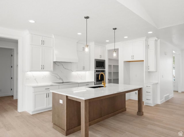 2387 E Canyon Crest Dr Unit 44, Spanish Fork, UT 84660 - kitchen with stainless steel appliances, custom range hood, recessed lighting, tasteful backsplash, and white cabinets