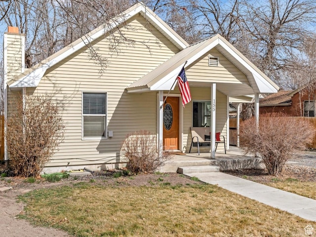 155 E 100 S, Payson, UT 84651 - bungalow-style house featuring a chimney, a front lawn, and covered porch