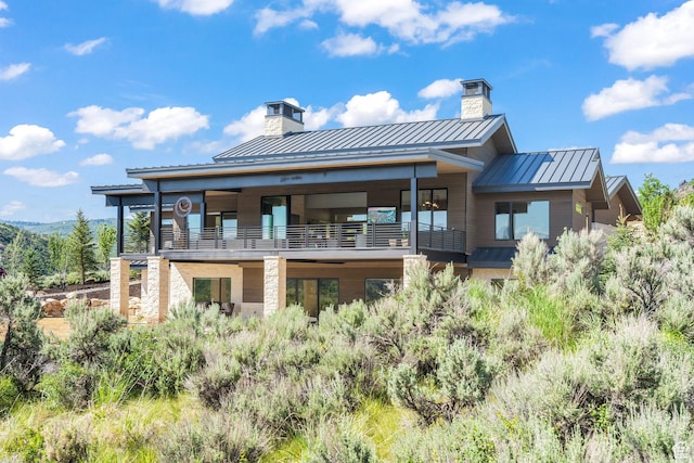 2344 Nighthawk Cir, Park City, UT 84098 - back of property featuring a standing seam roof, metal roof, a chimney, and a balcony