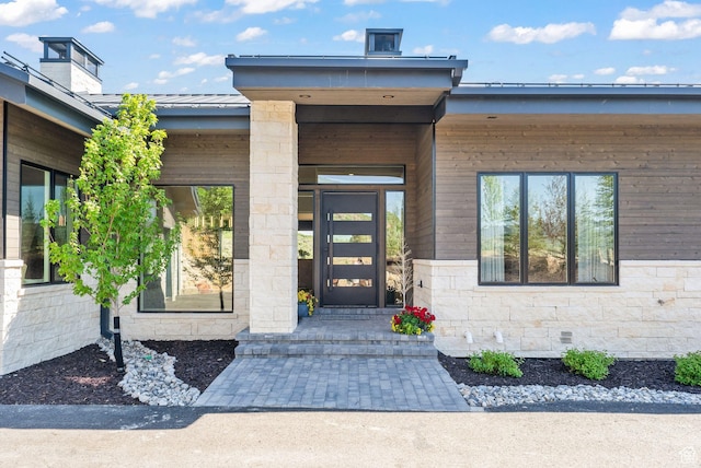 2344 Nighthawk Cir, Park City, UT 84098 - view of exterior entry with metal roof, crawl space, a standing seam roof, and stone siding