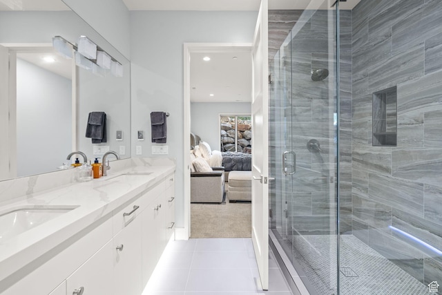 2344 Nighthawk Cir, Park City, UT 84098 - ensuite bathroom featuring double vanity, a stall shower, connected bathroom, a sink, and tile patterned flooring