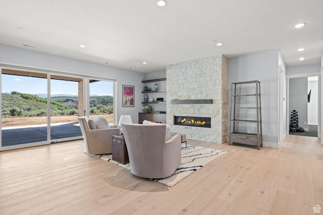 2344 Nighthawk Cir, Park City, UT 84098 - living area with a fireplace, wood finished floors, and recessed lighting
