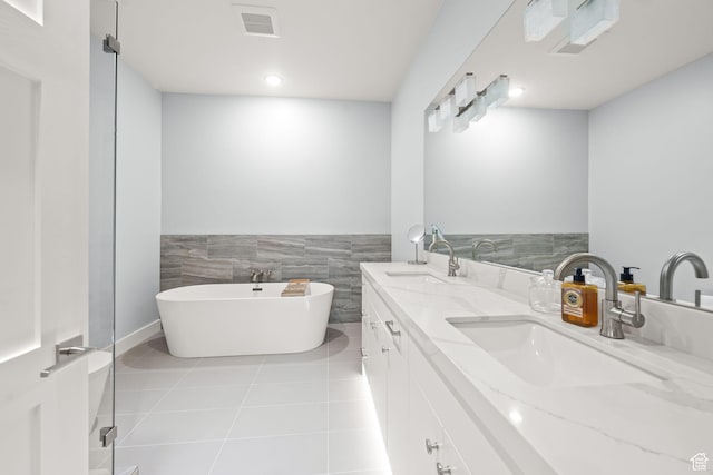 2344 Nighthawk Cir, Park City, UT 84098 - bathroom with a soaking tub, visible vents, a sink, and tile patterned floors