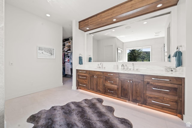2344 Nighthawk Cir, Park City, UT 84098 - bathroom featuring double vanity, a spacious closet, a sink, and recessed lighting