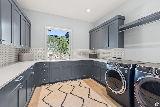 2344 Nighthawk Cir, Park City, UT 84098 - laundry area featuring recessed lighting, a sink, washer and dryer, cabinet space, and light wood finished floors