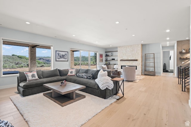 2344 Nighthawk Cir, Park City, UT 84098 - living area featuring baseboards, a stone fireplace, recessed lighting, and light wood-style floors