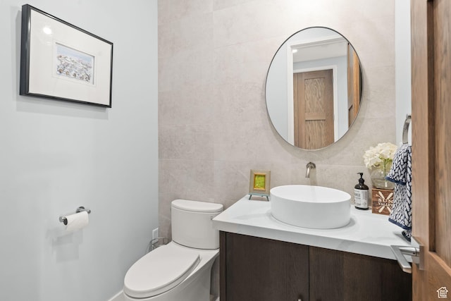 2344 Nighthawk Cir, Park City, UT 84098 - half bath featuring tile walls, vanity, toilet, and decorative backsplash
