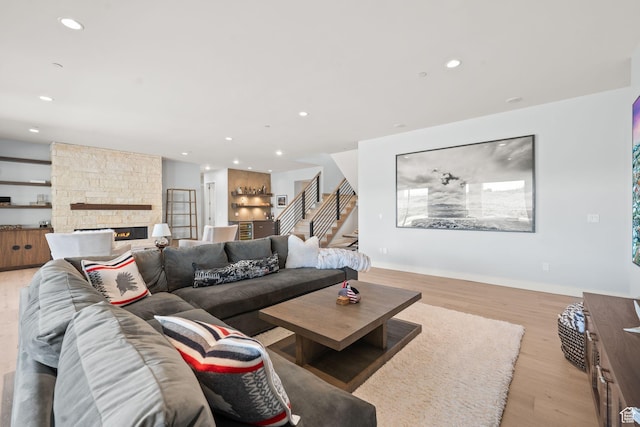 2344 Nighthawk Cir, Park City, UT 84098 - living room with recessed lighting, a stone fireplace, stairway, and light wood finished floors