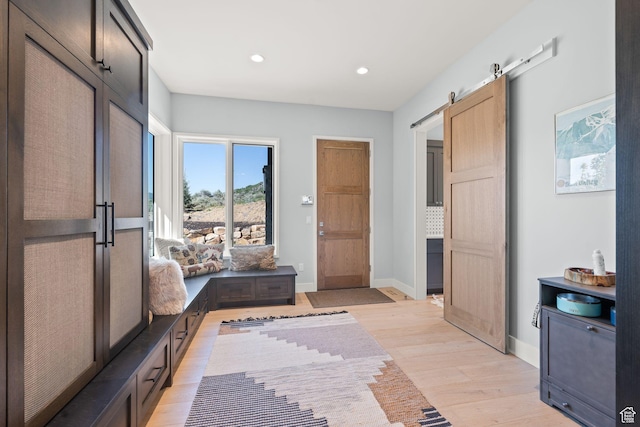 2344 Nighthawk Cir, Park City, UT 84098 - mudroom featuring light wood-type flooring, a barn door, baseboards, and recessed lighting