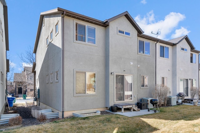 2616 N Elm Dr, Lehi, UT 84043 - back of property featuring central air condition unit, a yard, a patio, and stucco siding