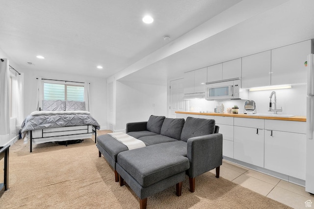 2616 N Elm Dr, Lehi, UT 84043 - living area with light tile patterned floors, baseboards, light colored carpet, and recessed lighting
