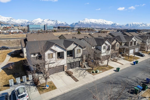 drone / aerial view with a residential view and a mountain view