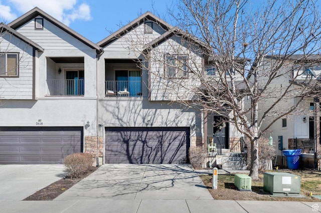 2616 N Elm Dr, Lehi, UT 84043 - multi unit property featuring concrete driveway, a balcony, an attached garage, and stucco siding