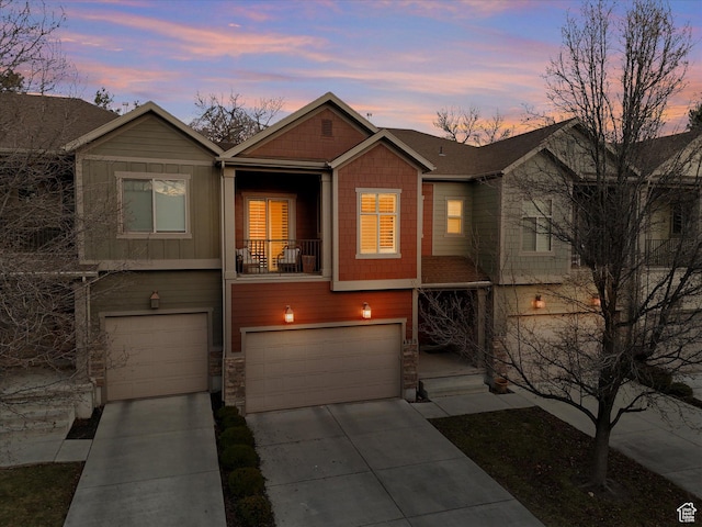 4823 S Brooks Way, Holladay, UT 84117 - view of front of property featuring a garage, stone siding, a balcony, board and batten siding, and driveway