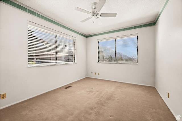 3604 S Crestwood Dr, Salt Lake City, UT 84109 - carpeted spare room with a textured ceiling, ceiling fan, visible vents, and baseboards