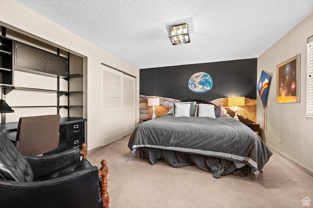 3604 S Crestwood Dr, Salt Lake City, UT 84109 - carpeted bedroom with an accent wall, a closet, a textured ceiling, and baseboards
