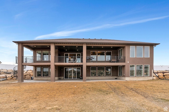 1407 E Abigail Ln, Eagle Mountain, UT 84005 - rear view of property featuring a patio and stucco siding