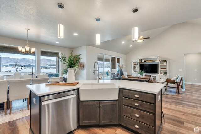 1407 E Abigail Ln, Eagle Mountain, UT 84005 - kitchen with dishwasher, open floor plan, light countertops, dark brown cabinets, and a sink