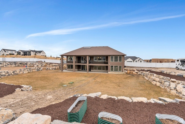 1407 E Abigail Ln, Eagle Mountain, UT 84005 - back of house featuring a patio area, a fenced backyard, and a yard