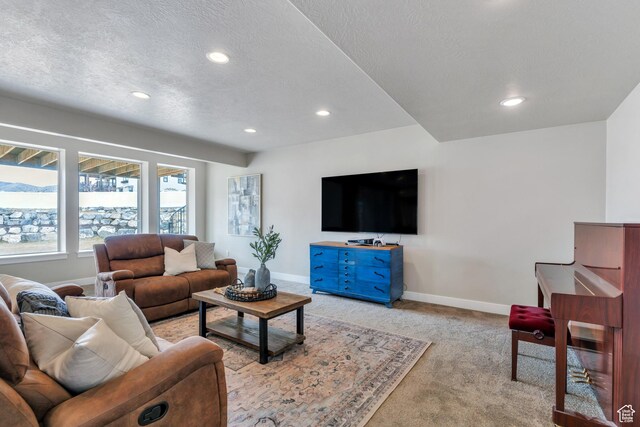 1407 E Abigail Ln, Eagle Mountain, UT 84005 - living room with a textured ceiling, recessed lighting, carpet, and baseboards