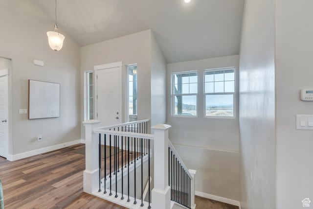 1407 E Abigail Ln, Eagle Mountain, UT 84005 - interior space featuring vaulted ceiling, baseboards, and wood finished floors