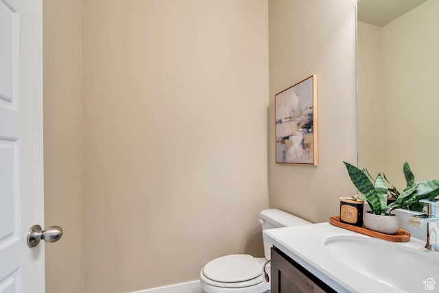 1407 E Abigail Ln, Eagle Mountain, UT 84005 - bathroom featuring toilet, baseboards, and vanity