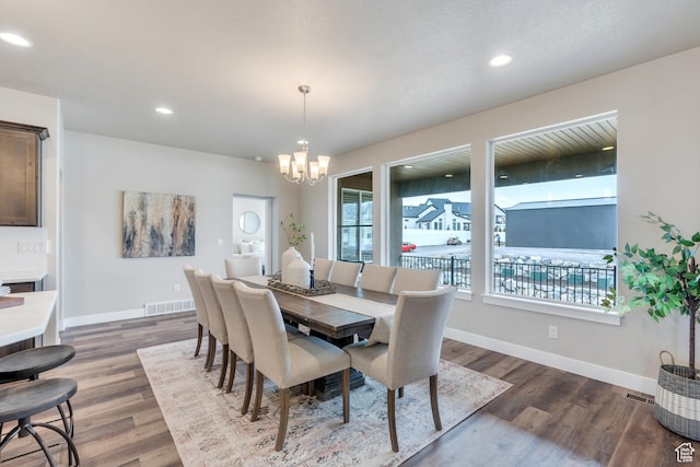 1407 E Abigail Ln, Eagle Mountain, UT 84005 - dining space with baseboards, a chandelier, and wood finished floors