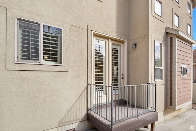 doorway to property with stucco siding