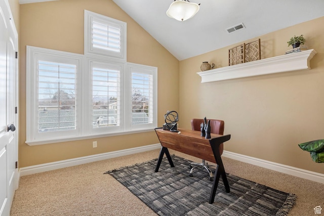 carpeted office space featuring vaulted ceiling, visible vents, and baseboards