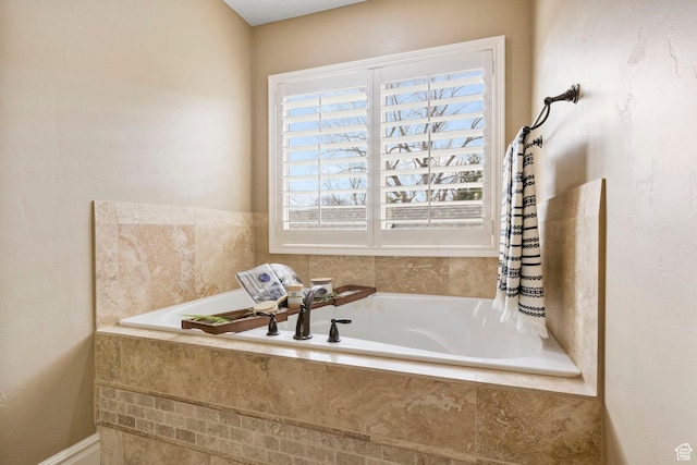 bathroom with tiled tub