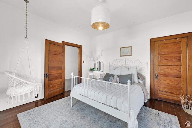 bedroom with wood finished floors