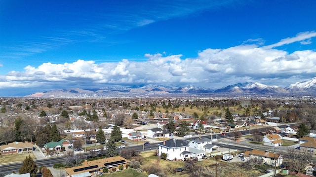 drone / aerial view featuring a mountain view and a residential view