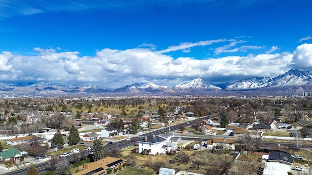 birds eye view of property with a mountain view and a residential view