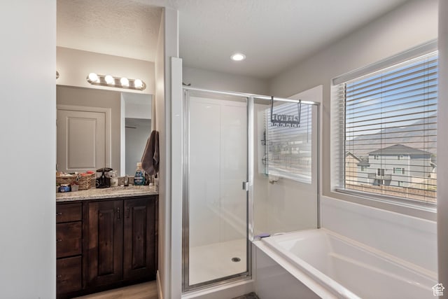 1933 E Handcart Ln N, Spanish Fork, UT 84660 - full bath featuring a textured ceiling, a stall shower, vanity, and a bath
