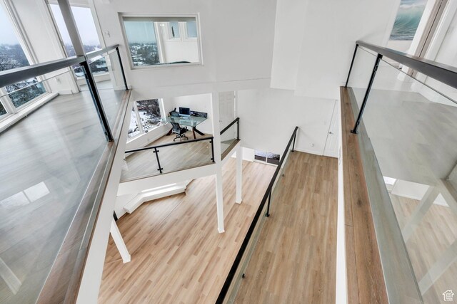 stairs with visible vents and wood finished floors